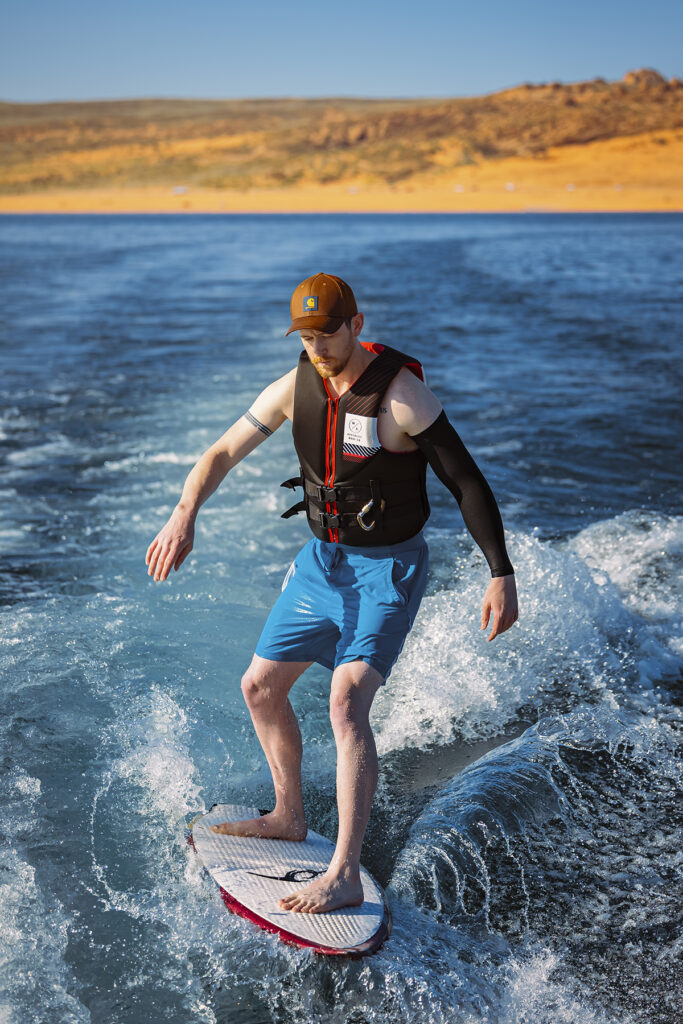 Rex Jones wakesurfing on a lake in Utah, captured during a commercial photography session focused on water sports and active lifestyle.